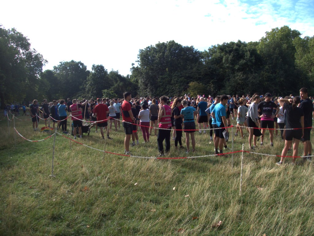 A field of people including volunteers at Highbury Fields parkrun