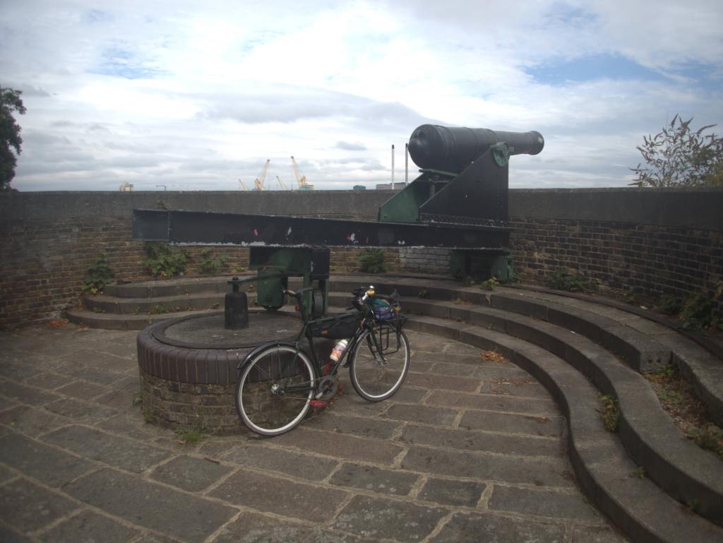 Photo of my bicycle leaning against a cannon.