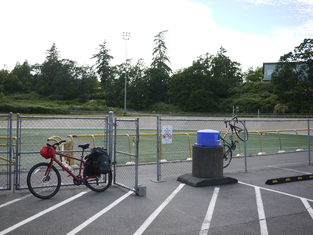 Photo of my bicycle. The outdoors velodrome in Victoria is hehind.